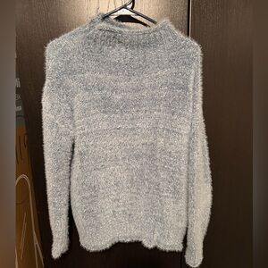 Blue fuzzy turtleneck sweater